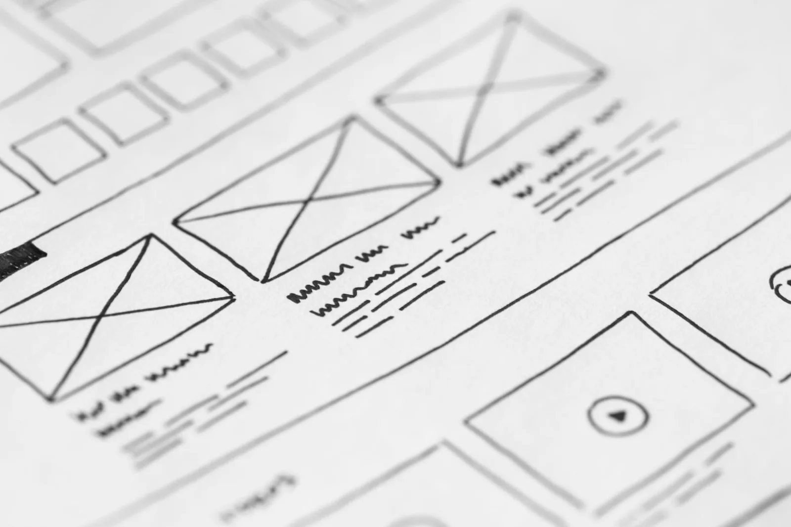 Hand-drawn wireframe design on paper for a UX project